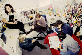 Photograph of students gathered together and chatting in the residence dorm