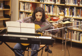 Photograph of a solo guitar performance in the Keelesdale library