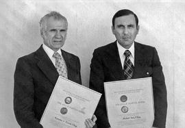 Photograph of Kuetoslav S. Turecek and Mike Sava Displaying Their Engineering Degrees