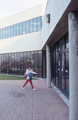 Photograph of a person at the entrance of a building