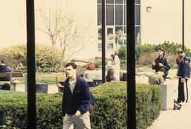 Photograph of students sitting in the courtyard