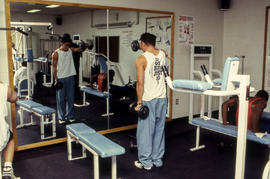 A photograph of students using fitness equipments