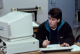 Photograph of a student in a technology computer lab