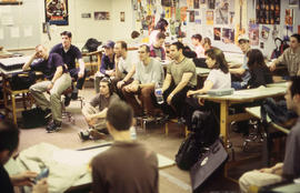 A photograph of seated and attentive students in class