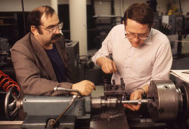 Photograph of a Student Working With a Metal Lathe