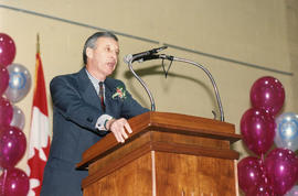 Photograph of President Robert "Squee" Gordon giving a speech at the President's Breakfast