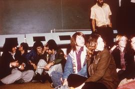 Students sitting on the floor : [photograph]