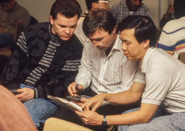 Photograph of students working on an assignment together