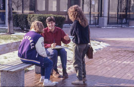 Photograph of students talking in front of the Registration entrance