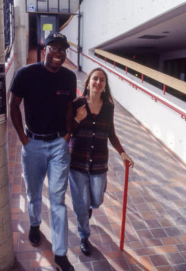 Photograph of two students walking in Building K