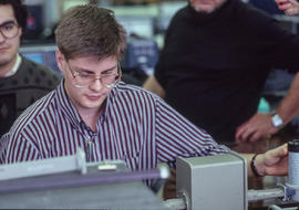 Photograph of a Technology instructor supervising use of electronic measurement equipment