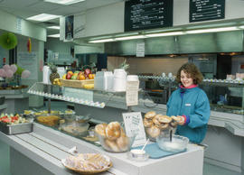 Photograph of a student grabbing food in the Student Residence cafeteria
