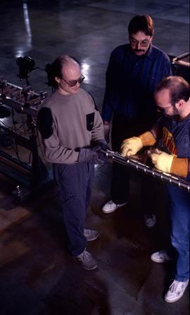 Photograph of students operating an equipment