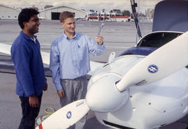 Photograph of a person giving aviation instruction at the Billy Bishop Toronto Island airport