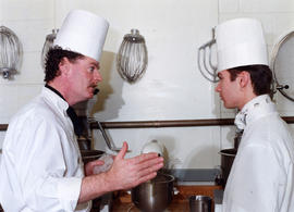 Photograph of a culinary instructor and student