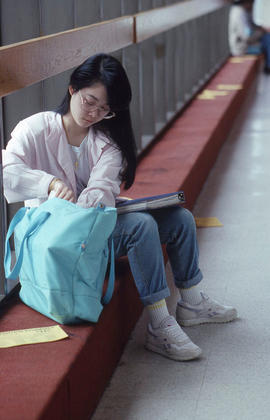 Photograph of a student sitting by a window