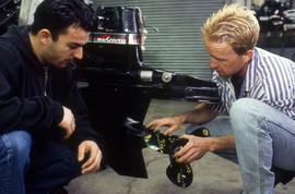 Photograph of Robert Smith and student in the Small Engine Repair lab