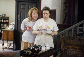 Photograph of students rehearsing and dressing a set