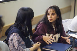 Photograph of Two Students Talking in Class
