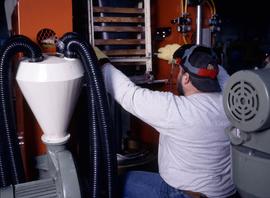 Photograph of a student operating an equipment at the Canadian Plastics Training Centre