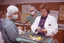 Photograph of Susan Schulte instructing students in an Operating Room Nurse exercise