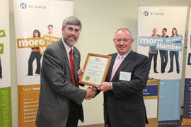 Photograph of Deputy Mayor Warren Maycock presenting a certificate to President John Davies