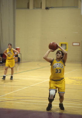 Photograph of girls basketball player making a shot