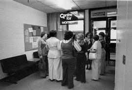 Photograph of a Group of Women Gathered Outside of the Entrance to the Centre for Women