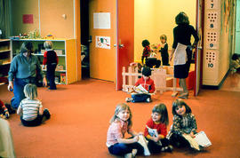 Photograph of Early Childhood Education students with children in the North campus Daycare
