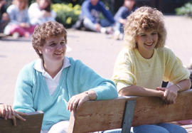 Photograph of two persons enjoying a performance