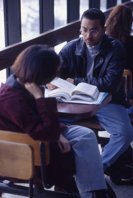 Photograph of Two People Talking in the Kites Cafeteria
