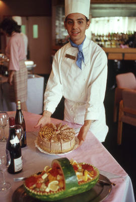 Photograph of a pastry chef at the dessert table