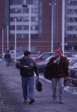 Photograph of people getting around campus on a pathway