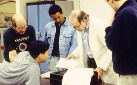 Photograph of Roy Fraser and students