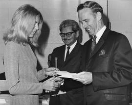 Photograph of Don Chow Presenting an Award to a Student