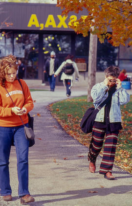 Photograph of students walking on pavement by the "A", "AX" and "B"...