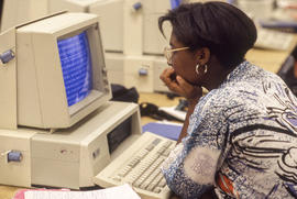 Photograph of a student working at a computer station