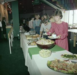 Photograph of guests at a buffet table