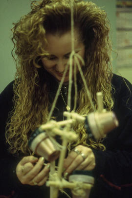 A photograph of Retail Floriculture student building a floral arrangement
