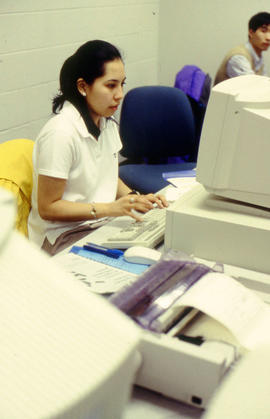 Photograph of student working in the computer