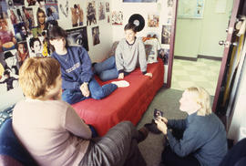 Photograph of students gathered in a residence dorm