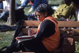Photograph of a Student Sitting on a Bench