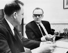 Photograph of a meeting with Douglas E. Light and Harry Edmunds