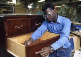 Photograph of a student working on their woodworking project