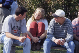 Photograph of Students Sitting and Talking on a Bench