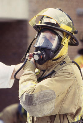 A photograph of a Firefighting student in gear