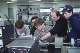 Photograph of a Technology instructor demonstrating electronic measurement equipment