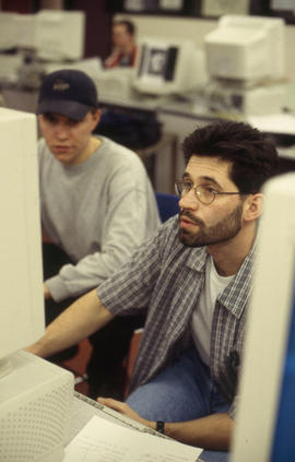 A photograph of two students at a computer