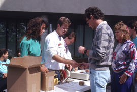 Photograph of persons selling tickets