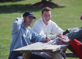 Photograph of students at a picnic bench in the Arboretum